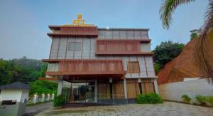 a building with a tower on top of it at SKY PENTA RESIDENCY in Iritti