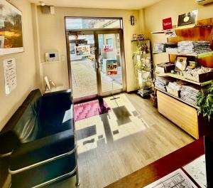 a room with a sliding glass door in a store at Tabist International Hotel Kaike in Yonago +77 photos