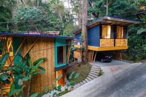 a house in the middle of a forest at Dos Olas Ocean-Inspired Luxury Villa in Quepos