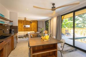 a kitchen with a table with bananas on it at Dos Olas Ocean-Inspired Luxury Villa in Quepos