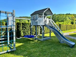 a playground with a slide and a play structure at Hotel Fero Express POKOJE KLIMATYZOWANE AC in Krakow