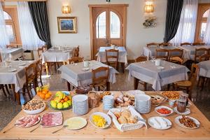 a table with many plates of food in a restaurant at Albergo Trattoria Speranza in Foza