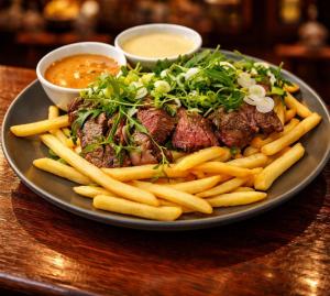 a plate of food with meat and french fries at THE YoRK in Morecambe +31 photos