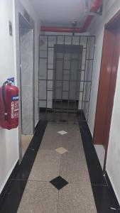 a hallway with a fire hydrant in a room at STADEVIEW MODERN STUDIOs in Gatunga