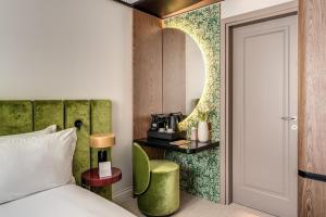 a hotel room with a bed and a mirror at Hotel Santa Maria Maggiore in Rome +28 photos