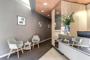 a waiting room with chairs and a counter at Hotel Santa Maria Maggiore in Rome