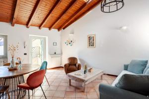 a living room with a couch and a table at Like Home XX Settembre in Sesto Calende