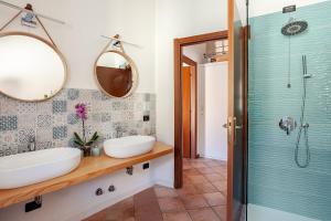 a bathroom with a sink and a shower at Like Home XX Settembre in Sesto Calende +33 photos