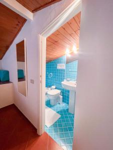 a bathroom with a toilet and a sink at Appartamenti sul mare in Santa Marinella +52 photos