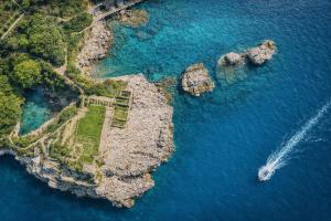an aerial view of an island in the water at Hotiday Sorrento Capo in Sorrento
