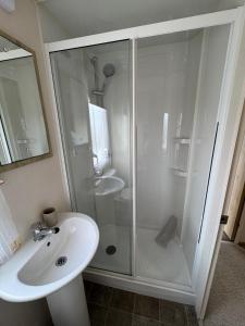 a bathroom with a shower and a sink at Captain's Cabin - Brixham - with designated parking in Brixham +16 photos