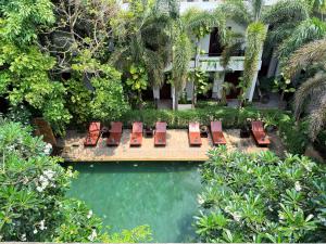 an overhead view of chairs and a pool of water at The Moon Residence & Spa in Siem Reap +108 photos