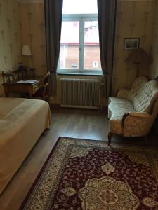 Postel nebo postele na pokoji v ubytování Hotell Läckö