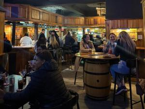 a group of people sitting at a bar at St Helena Bay Hotel in St. Helena Bay +17 photos