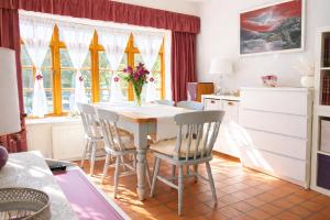 a kitchen and dining room with a table and chairs at 10 Pudding Bag Lane in Exton