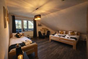 a bedroom with two beds and a large window at Fleiš Residence villa - jacuzzi included in Most