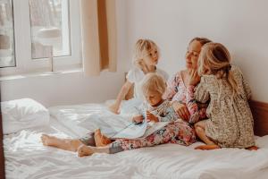 a group of people sitting on a bed at FOREST Family Resort Ustka in Ustka