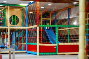 a room filled with cages filled with animals at FOREST Family Resort Ustka in Ustka