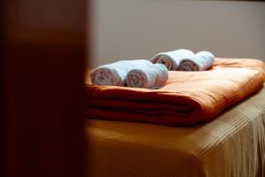 a group of towels sitting on top of a table at Olive Hostel Lagos in Lagos