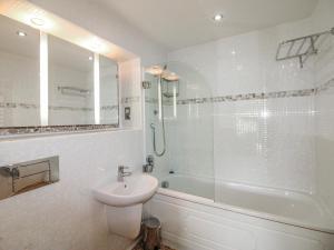 a bathroom with a sink and a shower and a toilet at 7 Ocean's Edge in Kingsbridge +24 photos