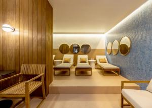 a therapy room with chairs and mirrors at Boutique Hotel Bristol in Košice