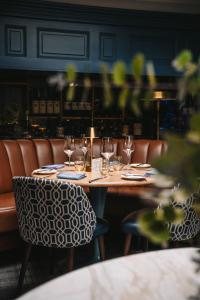 a table in a restaurant with wine glasses on it at Vaughans Anchor Inn in Liscannor