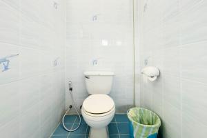 a bathroom with a white toilet and a blue floor at Vacation Home Tambon Karon in Karon Beach +21 photos