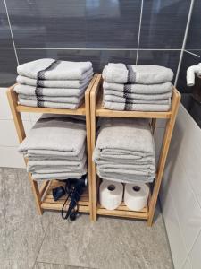 a towel rack with towels on it in a bathroom at Gästehaus Martha in Rust +57 photos