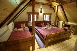 Postel nebo postele na pokoji v ubytování Holiday House Sobol
