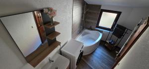 a bathroom with a toilet and a sink and a mirror at Apartment Me-Time in Bad Salzungen +11 photos