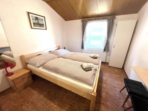 a bedroom with a bed in a room at Penzion Pochop in Benecko