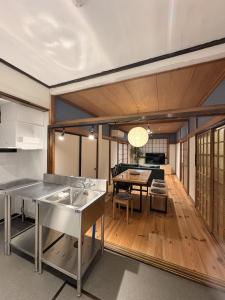 a kitchen and living room with a table and a dining room at 城北ノイエ by mooi in Aizuwakamatsu