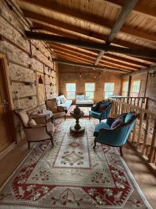 a living room with couches and chairs in a building at Osmanil Konağı in Aksiki