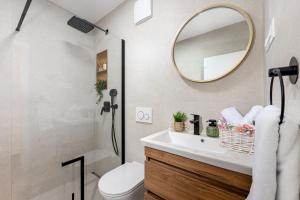 a bathroom with a sink and a mirror at Vila Pivac in Makarska +28 photos