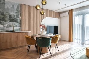 a dining room with a table and chairs at LEO Apartman in Veszprém