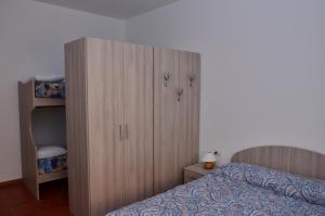 Łóżko lub łóżka w pokoju w obiekcie Casa di Leo