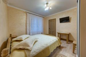 Letto o letti in una camera di Villa Anet