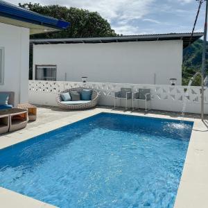 a swimming pool in the backyard of a house at Destino Beach Resort and Hotel in Batangas City