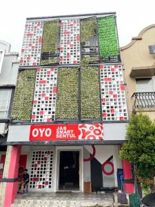 a building with plants on the side of it at Sentul Inn in Citaringgul 1 +11 photos