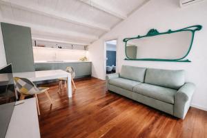 a living room with a couch and a table at Galé Suite Apartment in Chieti