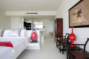 a bedroom with a large bed and a dining room at Villa Danisa 4BR Panoramic Ocean View with Infinity Pool & Private Gym in Choeng Mon Beach +53 photos