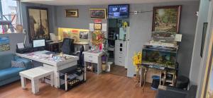 a room with a desk and a fish tank at Blue Amedist Hotel in Istanbul