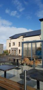 a building with a table in front of a building at Surfers Getaway - Room Staycation in Sligo