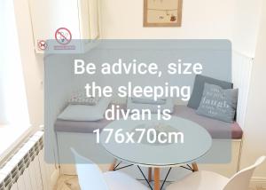 a table in a room with a sign that reads be advice seize the sleeping at Cazare Ceronav CityCenter Galati in Galaţi +49 photos