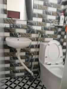 a bathroom with a sink and a toilet at Homestay846 in Vung Tau