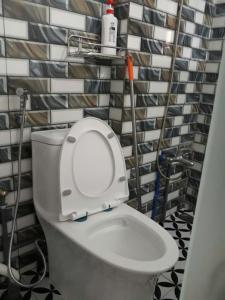 a bathroom with a white toilet in a room at Homestay846 in Vung Tau