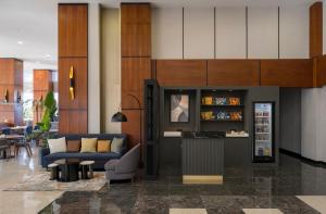 a lobby with a couch and a bar in a building at Crowne Plaza Istanbul West-Beylikduzu By IHG in Istanbul