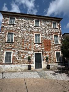 a large brick building with a door on it at Villa Sofia in Querceta