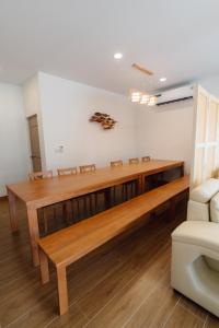 a dining room with a wooden table and chairs at Tenki poolvilla srisaket in Ban Phia Nam +21 photos