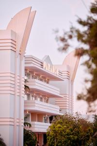 a building with a sign on the side of it at Paradiso Ibiza Art Hotel - Adults Only in San Antonio Bay